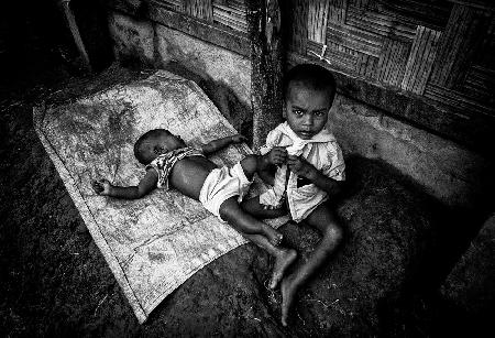 Rohingya boy taking care of his brother - Bangladesh