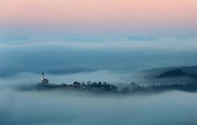 Saint Barbara above the clouds