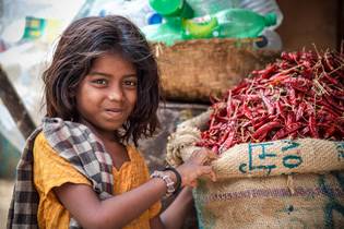 Girl and chilies in Bangladesh, Asia 