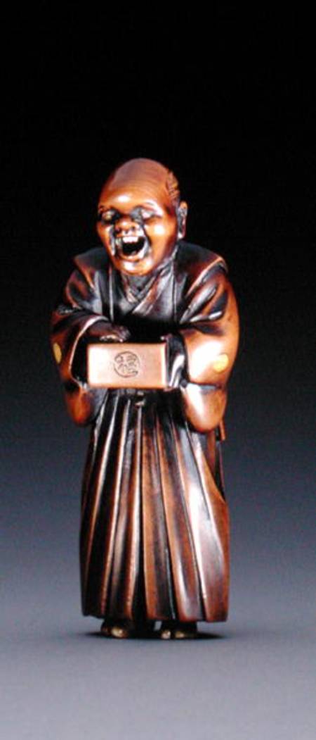 Netsuke depicting a standing priest from Miwa
